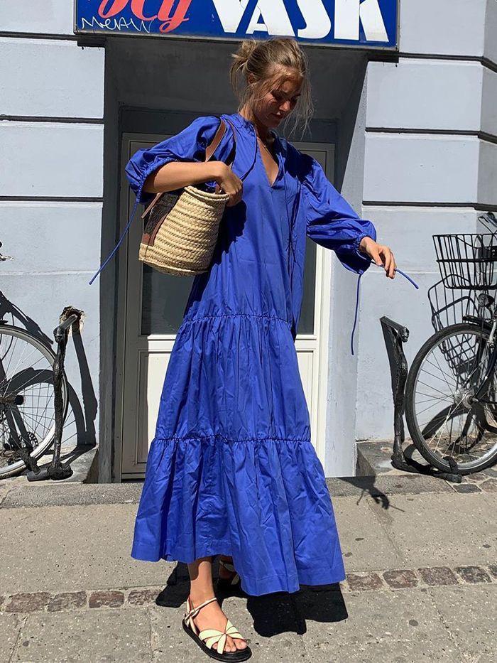 A women posing in blue Cotton Dress