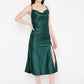 A beautiful lady in green silky satin dress