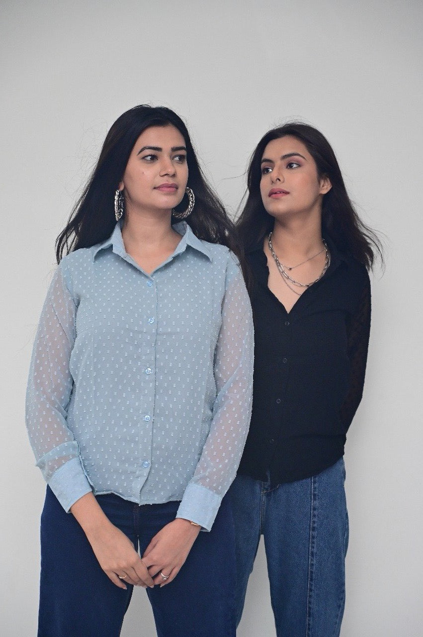 Two girl posing in a casual shirt