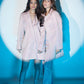Two Models posing in solid Pink blazer set dress