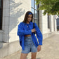 A Girl in a Blue Oversized Casual Shirt